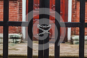 Metal chain on the red gate