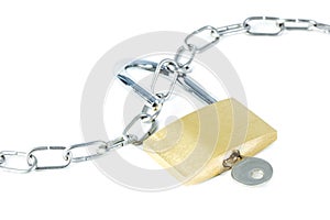 Metal chain and an unlocked padlock with key