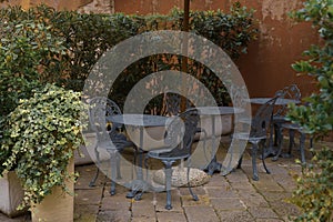 View of the chairs against the background of an old tenement house