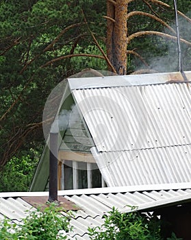 A metal chimney on a village house