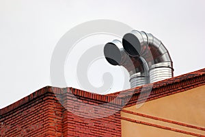 Metal chimneys on a roof