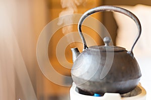 Metal Chinese teapot steaming