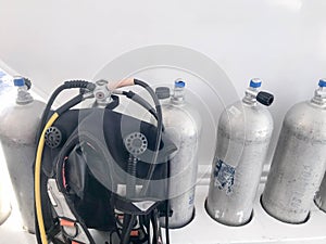 Metal chrome aluminum gas cylinders for breathing underwater, diving with valves, reducers and a suit for diving with hoses and je