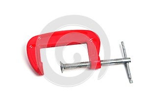 Metal clamp red on a white background isolate