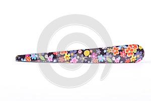 Metal clip in floral print.