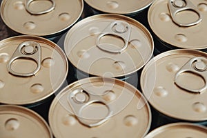 Metal closed canned food as a background image. Place for text or advertising. Top view