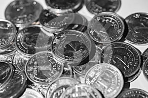 Metal coins, one and two hryvnia nominee, slide closeup on a white background