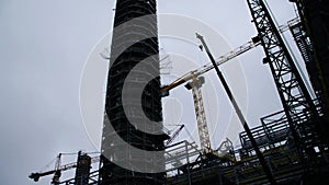 Metal construction of the future plant. Industrial zone,The equipment of oil refining,Close-up of industrial pipelines