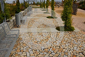 From metal constructions to climbing plants and vines is a sitting terrace of rough stone paving chipped cubes. metal gray furnitu