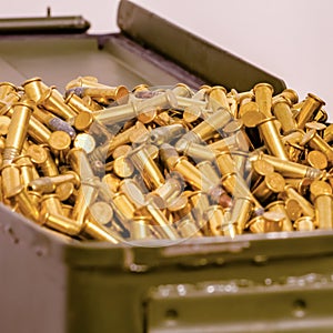 Metal container heaping with some shiny ammunition