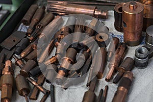 Metal copper workshop tools set on table