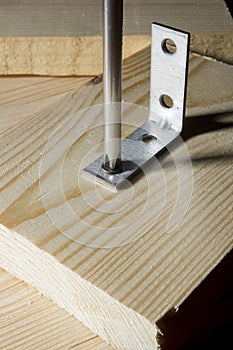 Metal corners for fastening wooden boards