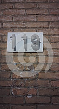 Metal covered with gray paint number one hundred nineteen or 119.