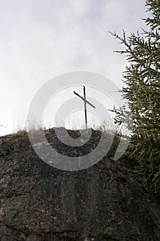 A metal cross on the hilltop. Conceptual.