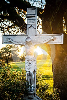 Metal Crucifix in Switzerland sun behind