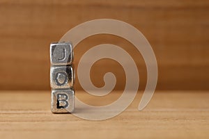 Metal cubes on a red wooden table