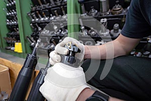 Metal-cutting cutters for a CNC machine in the hands of a worker to select tools