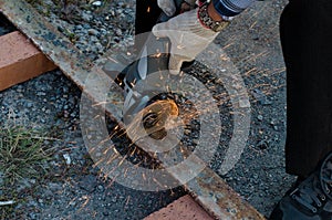 Metal cutting with a grinding machine with sparks.