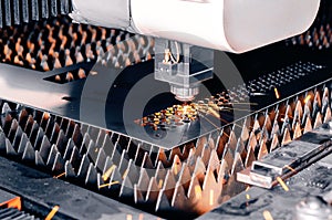Metal cutting machine. Laser cutting. Sparks from laser cutting. Close-up