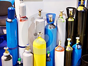 Metal cylinders for compressed gases