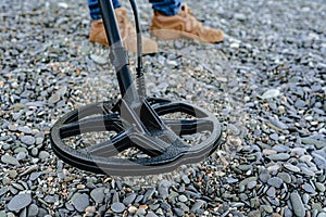 Metal detector coil in action above the ground