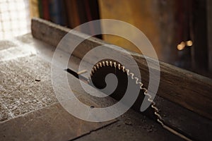 Metal dish of eletrical saw machine in the old table photo