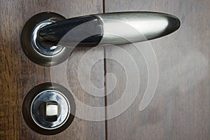 The metal door handle.