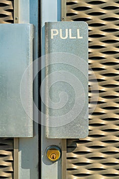metal door handle with the word pull