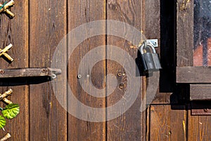Metal door lock on a brown background dark