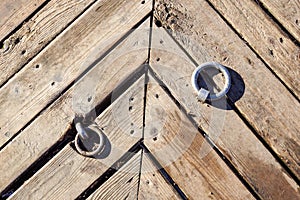 Metal door ring on the wall. Head Knocker.