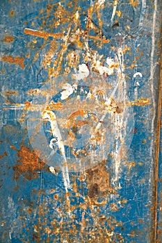 Metal door with rust, crack and old loose blue paint texture. Architect, pieces.