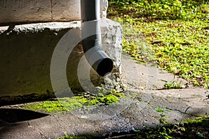 Metal downpipe at the corner