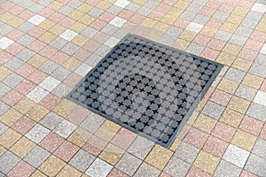 Metal drain surrounded by tiles