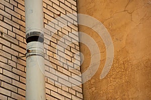 Metal drainpipe on the wall