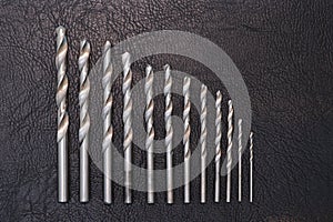 Metal drill set for drilling holes. Construction and home repair. Copy space for text