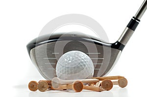 Metal driver with golf ball and tees photo