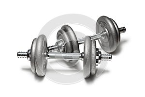 Metal dumbbells for fitness with chrome silver handle isolated on white