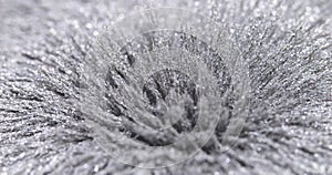 Metal dust, shavings, iron powder under the influence of a magnetic field. Abstract background.