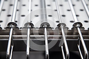 Metal equipment for drying dishes on professional kitchen. Selective focus. Shallow depth of field