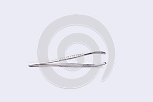 Metal eyebrow tweezers  on white background.