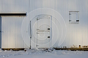 A metal farm building door in Iowa