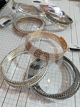 Metal fashion bracelets in white rhinestones, stylish and shiny jewelry for a female hand