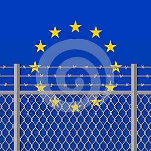 Metal fence with barbed wire on a European Union flag Separation concept Social issues on refugees or illegal immigrants