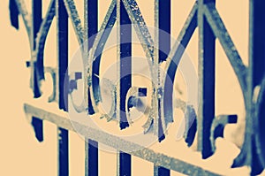 Metal fence close. Tinted photograph