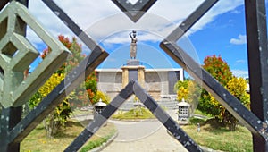 Metal fence combined with statue in Manatuto, Timor-Leste. photo