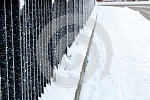 metal fence covered with frost. Frosty weather