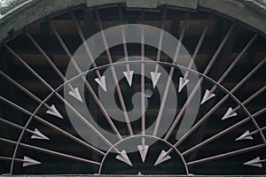 Metal fence decorated with sharp arrows into round form, Brown steel arrow