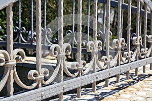 Metal fence. Metal curly fence in the park