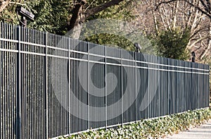 Metal fence with video cameras photo