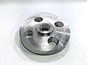 A metal flange threaded white background.